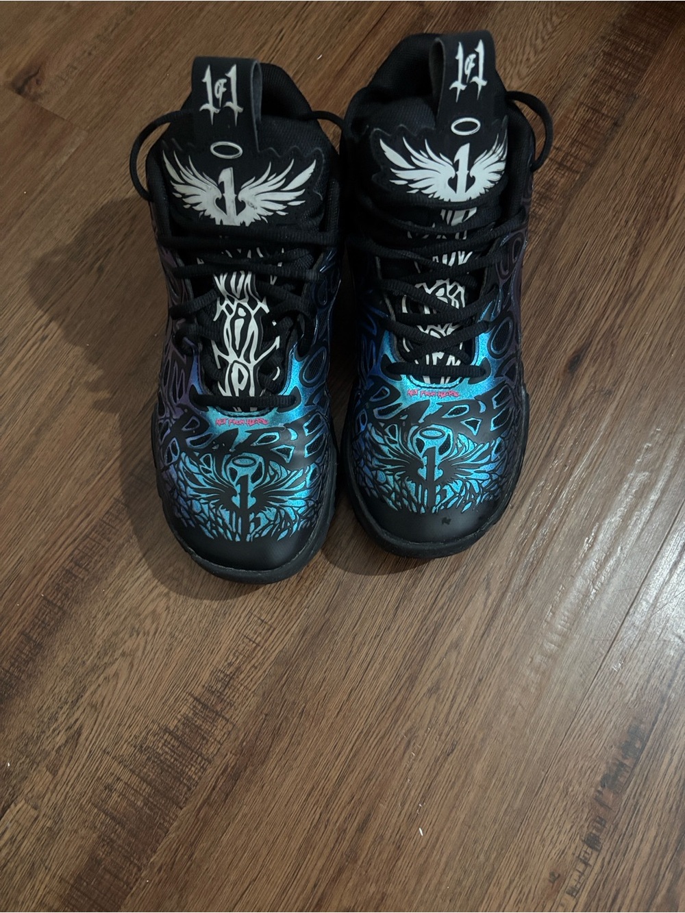 Puma Kids Black Sneakers with Blue Graphic Accents